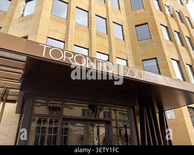 Low angle view of the Toronto Square office building entrance featuring sandstone masonry and a modern canopy. Leeds, West Yorkshire, United Kingdom. Stock Photo