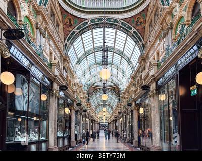Victorian architecture in County Arcade, Leeds, United Kingdom. Decorative glass roof, marble columns, and luxury retail storefronts. Stock Photo