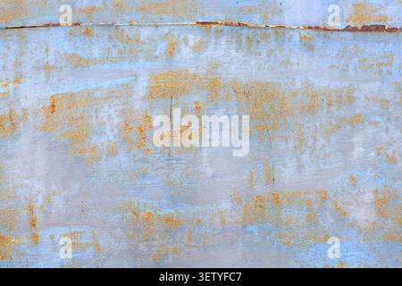 Galvanized steel sheet texture with rust spots and aged rivets. Industrial background and metallic texture with signs of corrosion. Vintage architectu Stock Photo