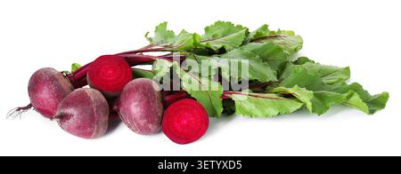 Whole and cut young beets with green leaves isolated on white Stock Photo