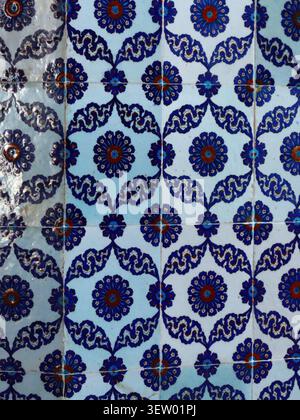 Istanbul - sep 24, 2024 - vintage ottoman turkish tile panel displaying intricate floral design, highlighting delicate blue and red ceramic craftsmans Stock Photo