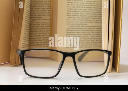 Antique Hungarian Book with Weathered Leather Cover and Aged Pages. Reading, read, glass, book Stock Photo