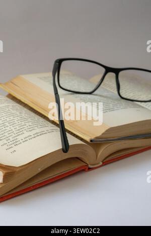 Antique Hungarian Book with Weathered Leather Cover and Aged Pages. Reading, read, glass, book Stock Photo