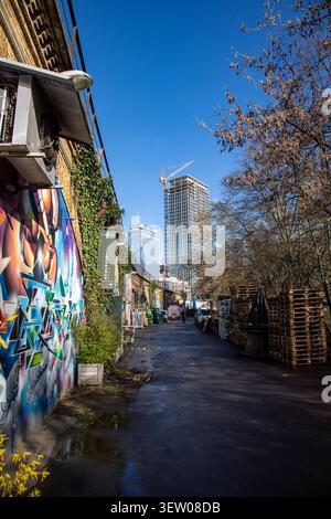 Elevated railway line on the left and The Berlinian office tower in the background in Mitte district of Berlin, Germany Stock Photo