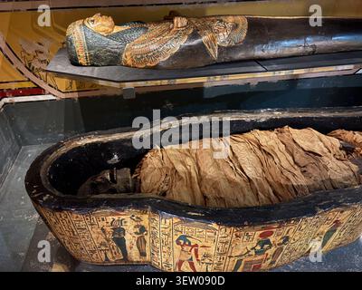 Ancient Egyptian mummies and painted wooden sarcophagi on display at Leeds City Museum, West Yorkshire, England. Stock Photo