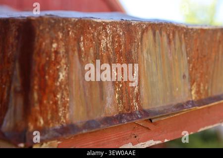 Close-up of weathered rusted steel beam showing natural oxidation and textured metal surface. Stock Photo