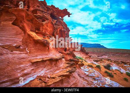 Red Sandstone Formations and Desert Landscape Under Dramatic Sky in Little Finland Stock Photo