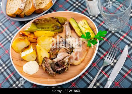 Roasted rabbit served with vegetable garnish Stock Photo