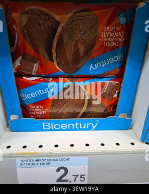 DENIA, SPAIN - January 26, 2026. Bicentury brand whole grain rice cakes with milk chocolate are displayed on a supermarket shelf in Spain. They are of Stock Photo