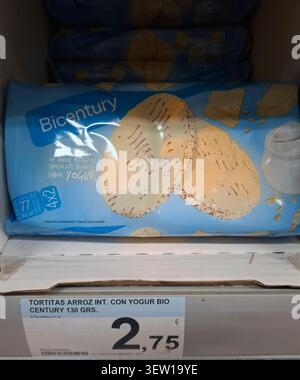 DENIA, SPAIN - January 26, 2026. Whole grain rice cakes with white chocolate and yogurt flavor are on display on supermarket shelf in Spain. They are Stock Photo