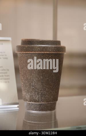 A Weducer reusable coffee cup made from recycled coffee grounds on display in Berlin, Germany. Stock Photo