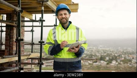 Tablet, man and portrait of construction worker on site with confidence for renovation on building. Digital technology, scaffolding and male civil Stock Photo