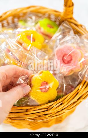 Wrapped Easter Cookie Sandwiches in Basket Stock Photo