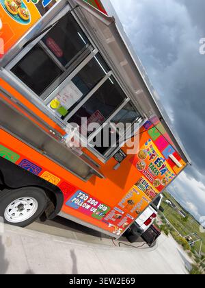 Colorful Food Truck Parked on Curbside Stock Photo