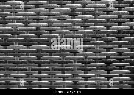 Black and white close-up of woven furniture showing repeating interlaced pattern Stock Photo
