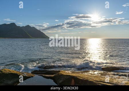 Dramatic sunset over the Norwegian Sea near Tungeneset, Senja island, Norway. Stock Photo