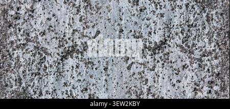 uneven cement plaster wall texture featuring a rough and natural surface with authentic imperfections. This realistic construction backgrounds Stock Photo