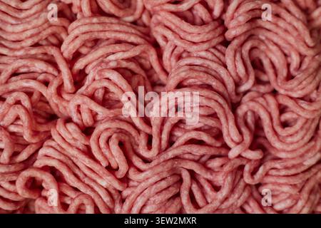 Fresh pork minced meat texture background. Top view of raw pork forcemeat. Stock Photo