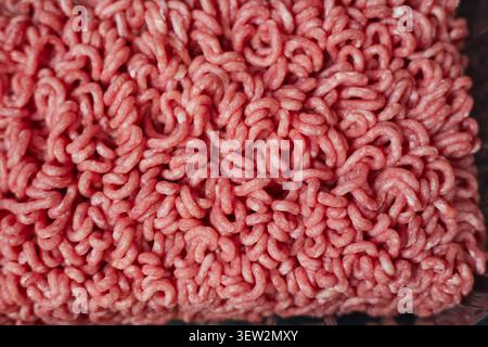 Fresh beef minced meat texture background. Top view of raw beef forcemeat. Stock Photo