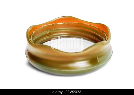 Brown plastic bottle cap lying isolated on white background Stock Photo