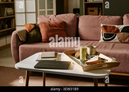 Home Office Workspace Featuring Laptop and Breakfast for Remote Work Stock Photo