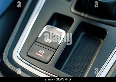 Electronic parking brake button in car interior Stock Photo