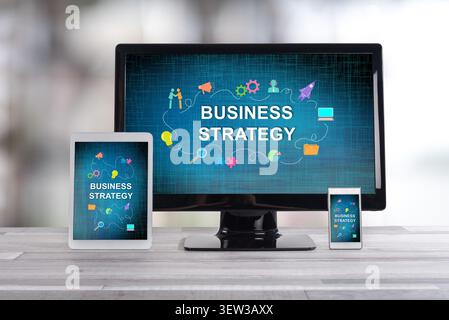 Business strategy concept shown on different information technology devices Stock Photo