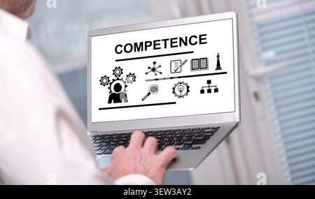 Competence concept shown on a laptop used by a man Stock Photo