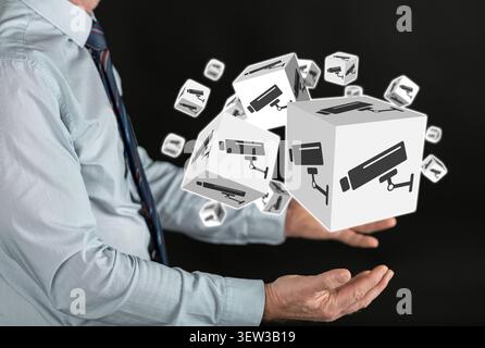 Security camera concept above the hands of a man Stock Photo