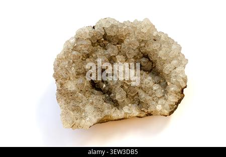Natural quartz geode crystal cluster isolated on white background showing sparkling translucent crystals with hexagonal shapes and rough outer surface beige gray color specimen illustrating geological mineral formation and natural crystal growth process Stock Photo