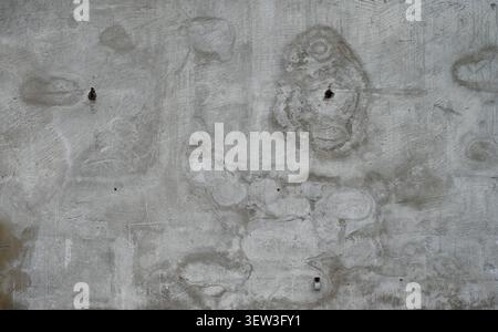 Close up horizontal view of a weathered concrete wall surface with rough texture, water spots Stock Photo