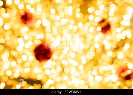 Abstract colorful light bokeh background with smooth yellow and red gradient. Festive blurred circles for digital art, Christmas, poster, and website Stock Photo