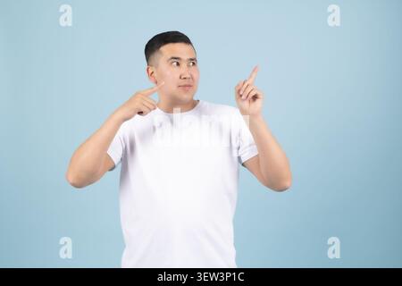 Young handsome man posing with various emotional facial expressions Stock Photo