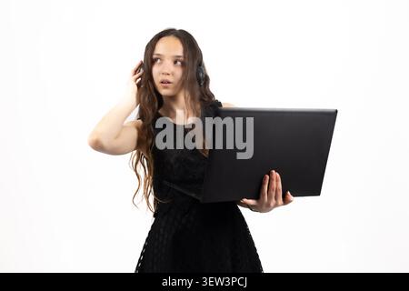 Successful young female student graduate holding certificate in studio Stock Photo