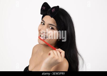 Beautiful young woman during studio photoshoot session isolated Stock Photo