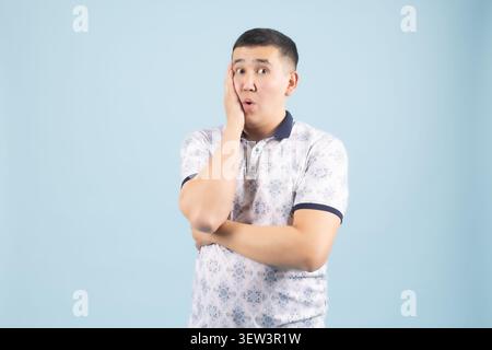 Young handsome man posing with various emotional facial expressions Stock Photo