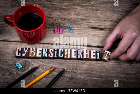 Cybersecurity With German Word Cybersicherheit Arranged With Vintage Letterpress Blocks Stock Photo