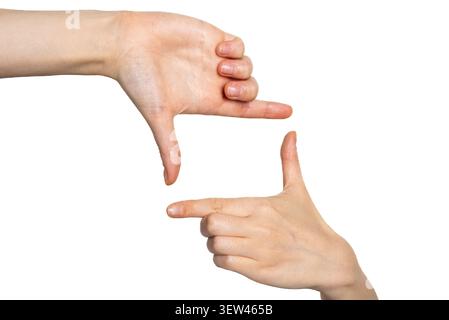 Close up of a hand pointing left on a plain white background. Stock Photo