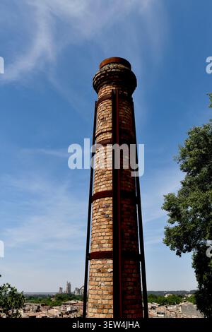 Old industrial chimny stack near Beaucaire Castle - chateau in Beaucaire in Provence, France, 2026 Stock Photo