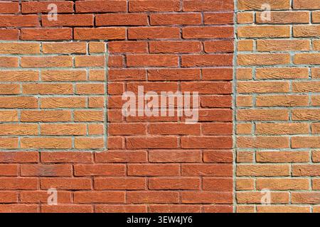 red brick wall with contrasting brick patches Stock Photo
