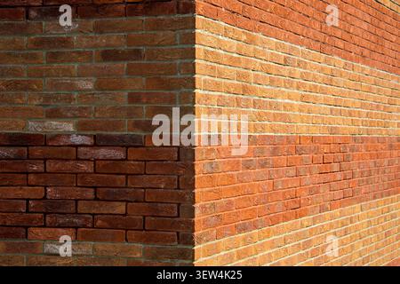 Red Brick Wall Corner With Textured Masonry, Sunlight and Shadow Stock Photo