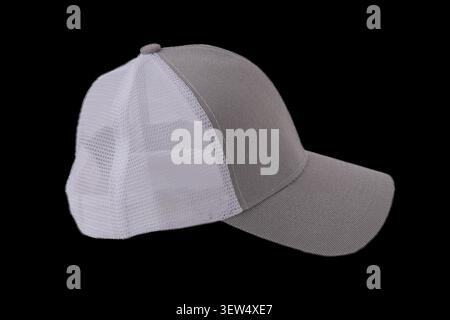 Mesh grey white Trucker Hat isolated on black Background. Baseball Cap Casual Headwear. Stock Photo