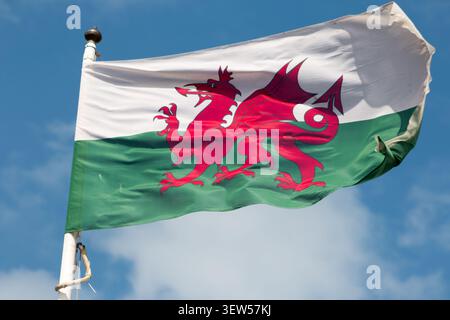 Flag of Wales (also known as Red Dragon) waving in Llandudno, a resort town in north Wales, United Kingdom. Stock Photo