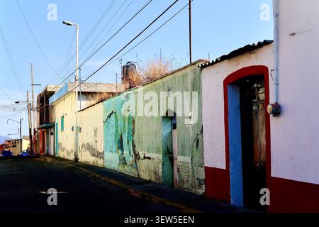 Weathered Mint and White Walls on Colonial Street with Strong Shadows (Atlixco, Puebla, Mexico) Stock Photo