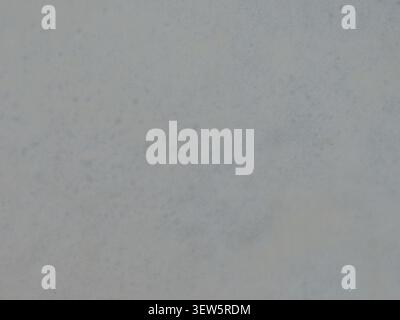 A light gray matte finish with a delicate texture. Soft smoky flecks and subtle blue tones emerge against the blurred background Stock Photo