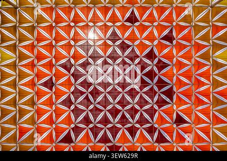 Abstract geometric pattern with vibrant orange and red architectural design Stock Photo