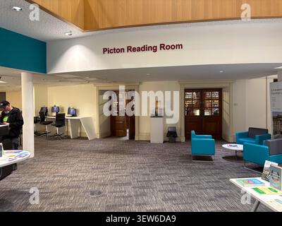 The entrance to the Picton Reading Room at the Liverpool Central Library, Liverpool, England, featuring wood doors and a modern library interior. Stock Photo