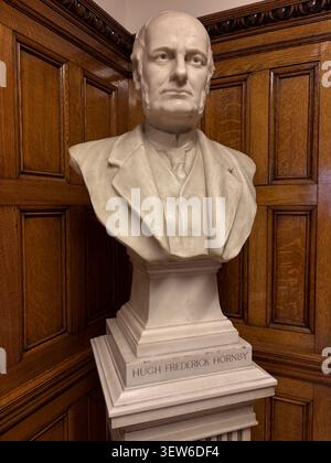 Marble sculpture of Hugh Frederick Hornby set against oak paneling in the Hornby Reading Room, Liverpool Central Library, Liverpool, England. Stock Photo