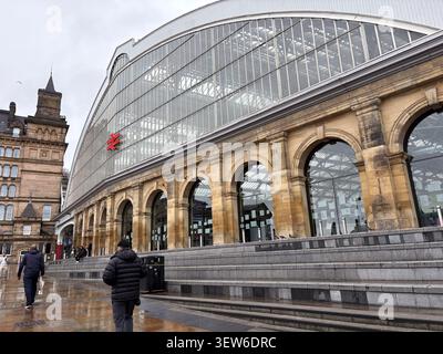 Victorian architecture of Liverpool Lime Street Station, a major railway hub in Liverpool, United Kingdom, under a cloudy sky. Stock Photo