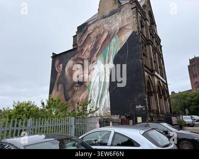 A 50ft surrealist mural by artist Liam Bononi on the side of The Wedding House building in Liverpool, England. Stock Photo